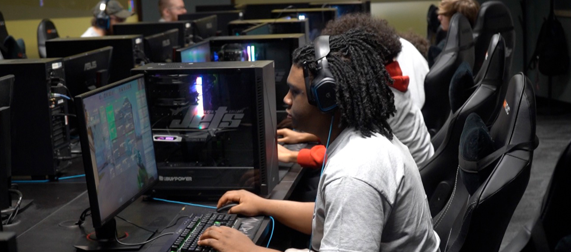 student at computer playing video game